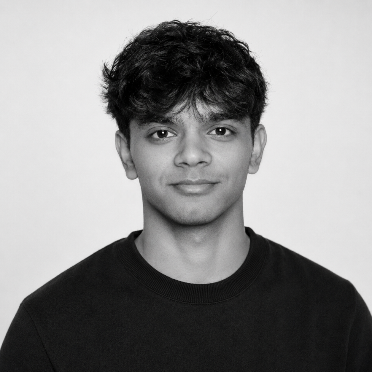Black and white headshot of Veer Patel